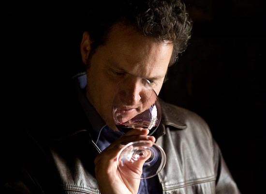 wine maker smelling wine